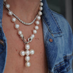 A sterling silver cross with freshwater pearls on Santayana signature interchangeable pearl necklace.