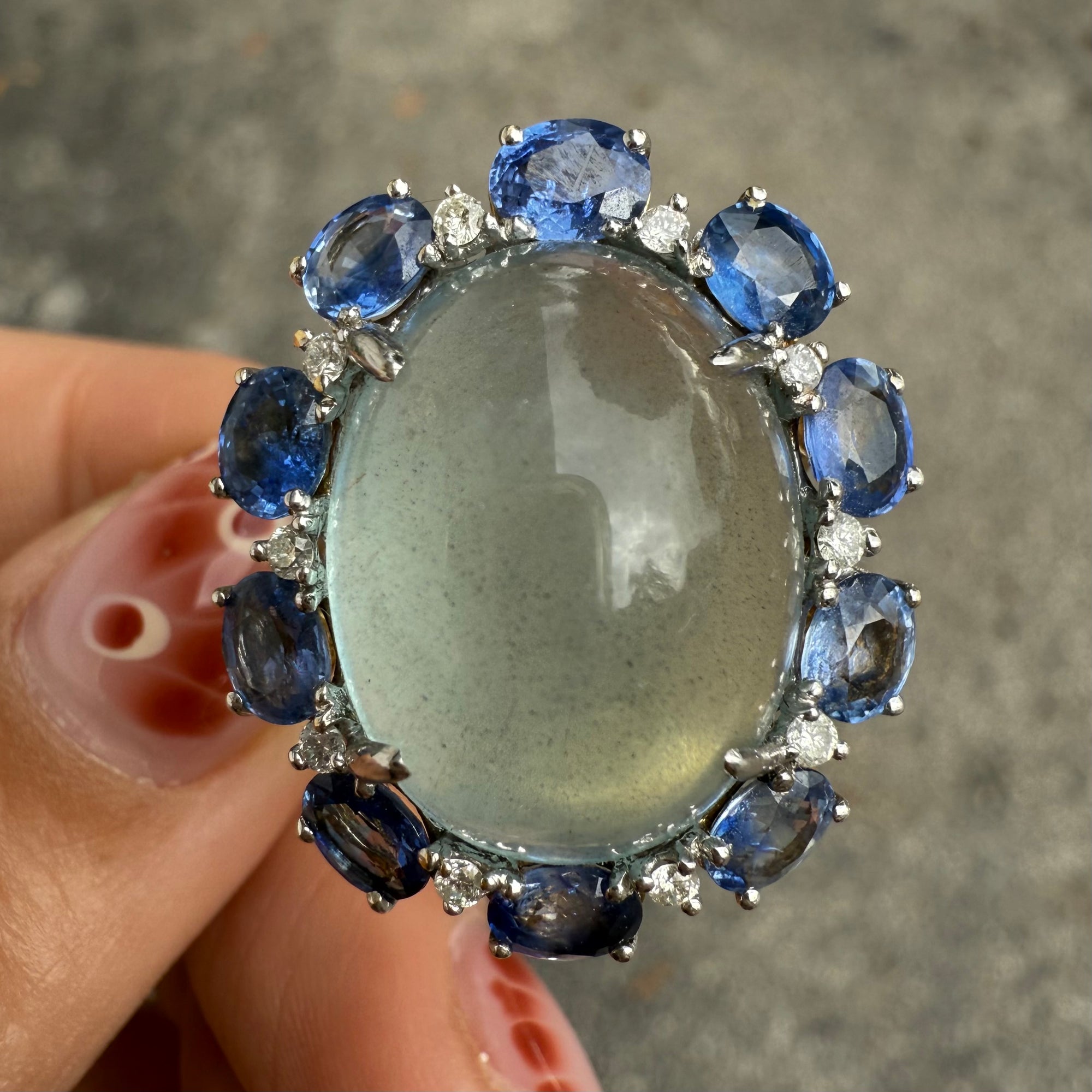 Aquamarine cocktail ring with sapphire and diamond accents in 14K gold, available at Santayana Jewelers Miami.