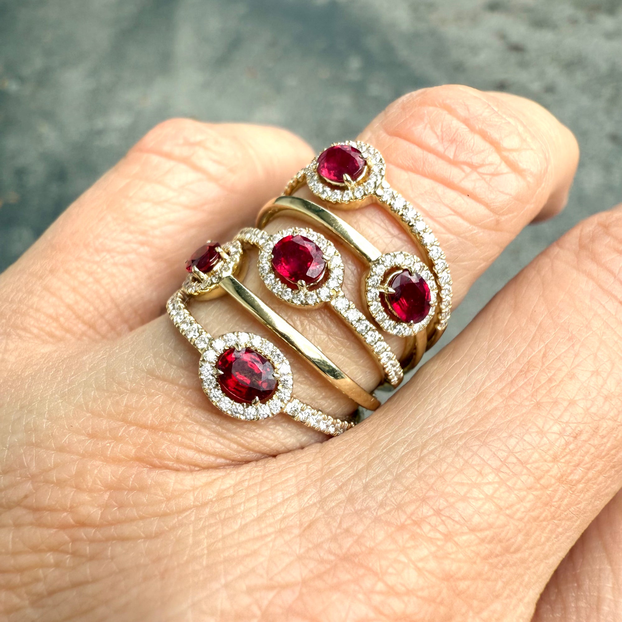 Ruby and diamond halo ring in 14K yellow gold, available at Santayana Jewelers Miami