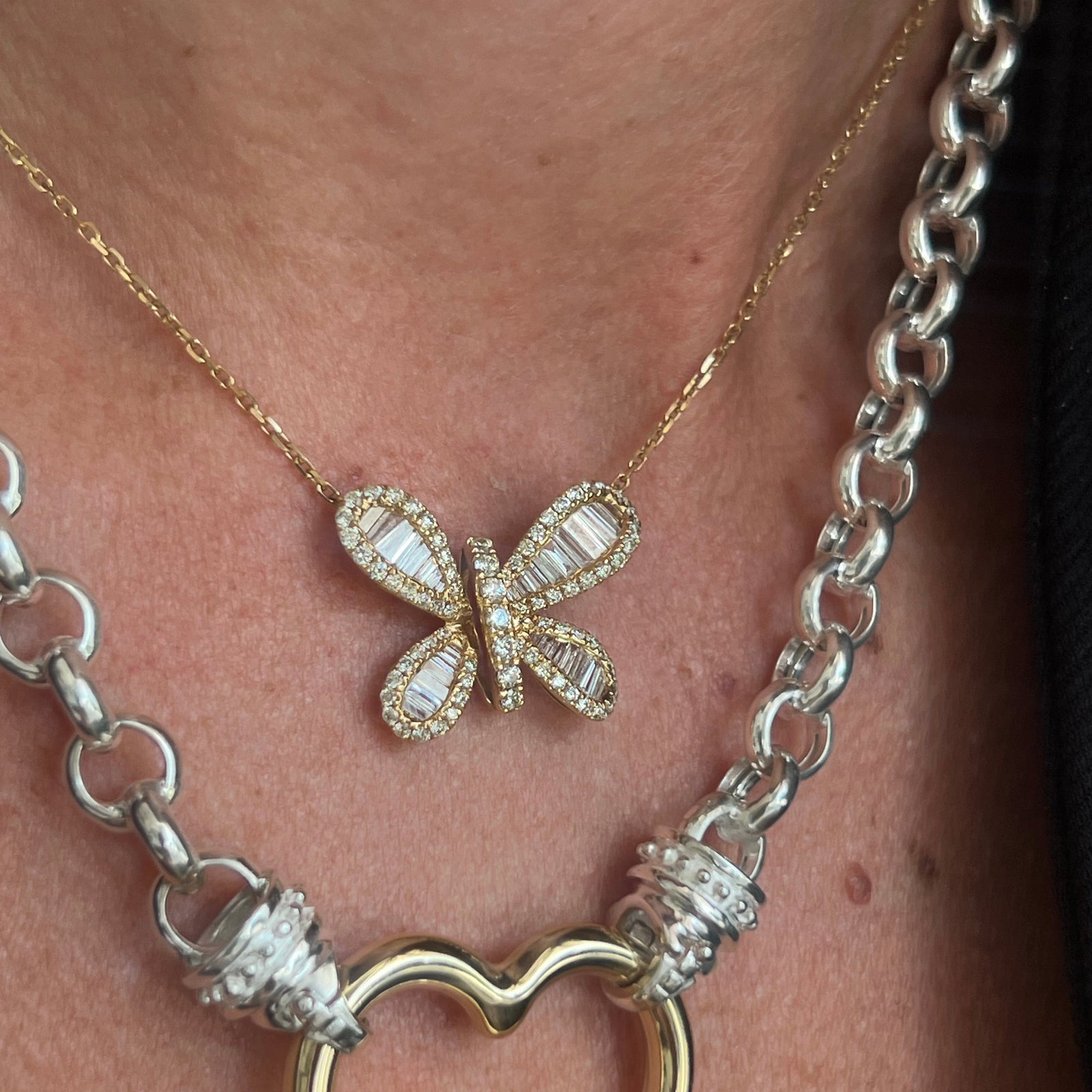 Baguette diamond butterfly on yellow gold. 