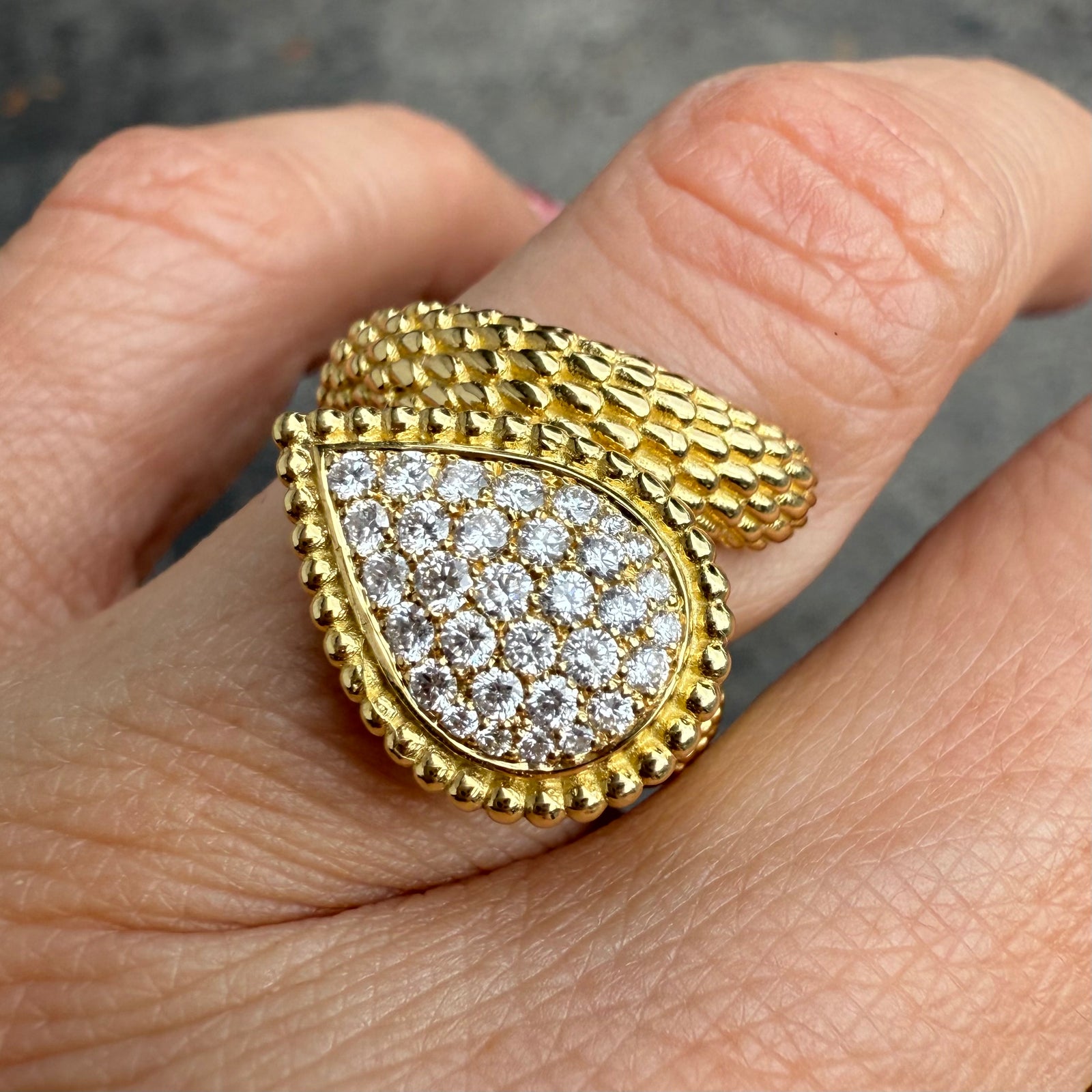 Diamond wrap ring in 18K yellow gold with textured dragon scale design
