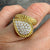 Diamond wrap ring in 18K yellow gold with textured dragon scale design